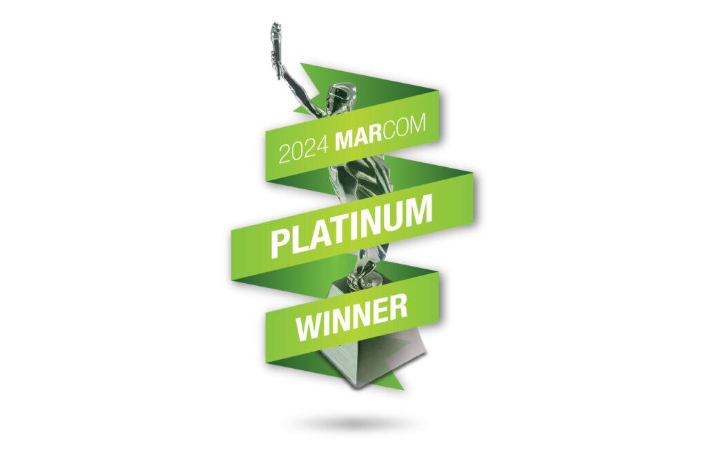Graphic for the 2024 MarCom Platinum Winner award featuring a silver trophy figure wrapped in a green ribbon with bold white text reading “2024 MarCom Platinum Winner.”
