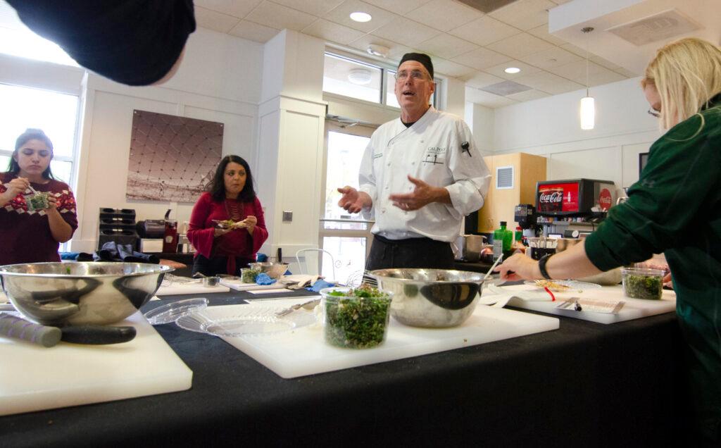 Chef teaching people how to cook