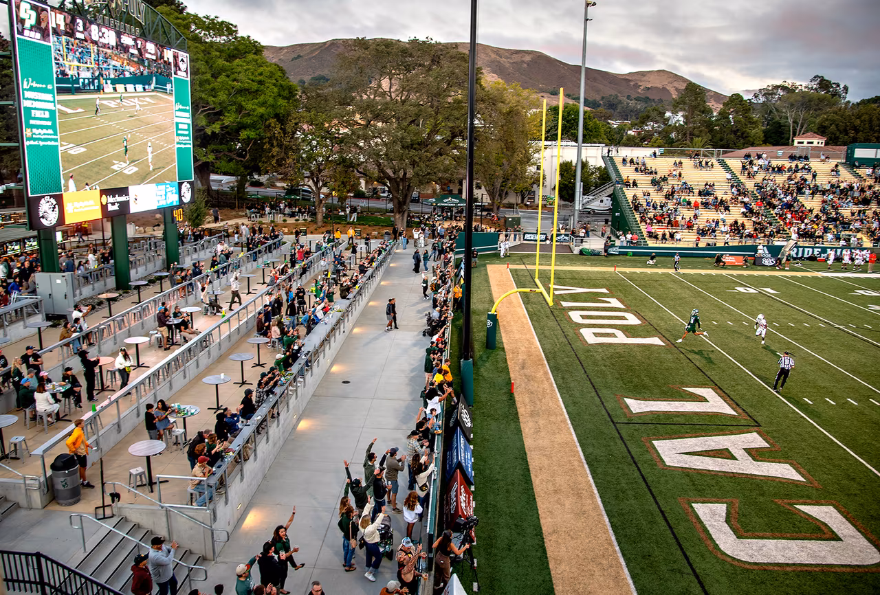 Image of Cal Poly's Stadium with people.